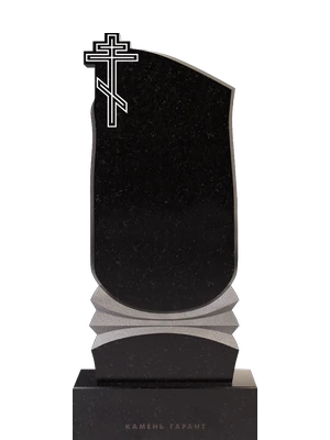 Христианский памятник с крестом и красивой резной частью 